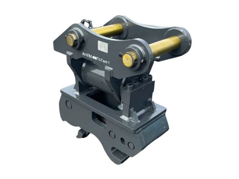 Heavy-duty industrial tilting clamp with two parallel gold rollers on a dark gray frame mounted to a base, used to hold or tilt large sections during handling.