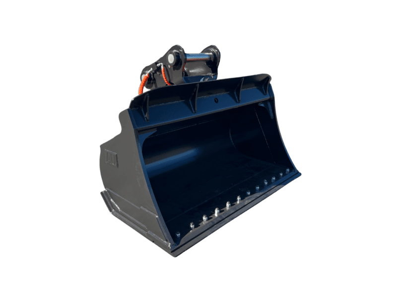 Large black front-end loader bucket, detached, in a storage yard with other buckets in the background.