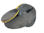 Circular black naval mine with yellow detonators along the rim (isolated).