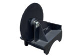 Industrial flywheel-based machine mounted on a metal stand, featuring a large circular wheel on the left and a sturdy base.