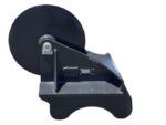 Industrial strap winding machine with a large black spool on a metal stand, used for packaging workflows.