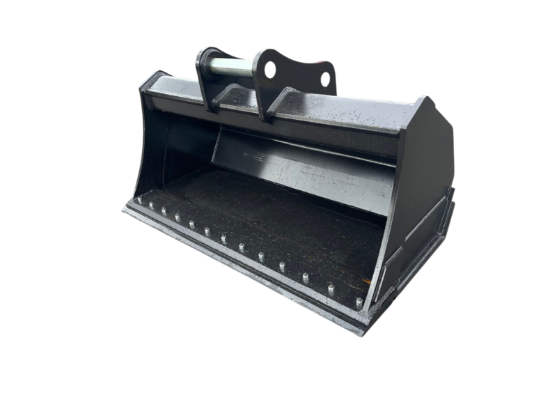 Dark metal skid-steer bucket attachment with a mounting bracket on top, isolated on a black background