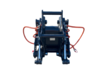 Blue hydraulic quick-attach coupler for heavy machinery with red high-pressure hoses, viewed from the front